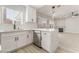 Bright, modern kitchen with white cabinets, stainless steel appliances, and a center island with pendant lighting at 5417 Bible Cir, North Las Vegas, NV 89031