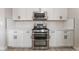 Close up on stainless steel oven and white cabinets, offering modern look and ample storage at 5417 Bible Cir, North Las Vegas, NV 89031