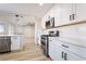 Spacious kitchen showcasing white cabinets, modern appliances, and open layout for easy entertaining at 5417 Bible Cir, North Las Vegas, NV 89031