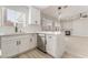 Bright, modern kitchen with white cabinets, stainless steel appliances, and a center island with pendant lighting at 5417 Bible Cir, North Las Vegas, NV 89031