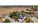 High aerial view showcasing the layout of the home in the neighborhood, with an empty lot nearby at 5515 N Campbell Rd, Las Vegas, NV 89149