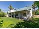 Spacious backyard showcasing the covered patio and lush greenery, perfect for outdoor enjoyment at 5515 N Campbell Rd, Las Vegas, NV 89149
