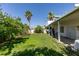 Expansive backyard with mature trees and a covered patio for relaxing outdoors at 5515 N Campbell Rd, Las Vegas, NV 89149