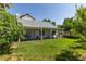 This home features a well-maintained backyard with a covered patio, and verdant trees at 5515 N Campbell Rd, Las Vegas, NV 89149