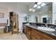 Bathroom features dual sinks with granite countertop, soaking tub, and vanity at 5515 N Campbell Rd, Las Vegas, NV 89149