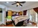 Bedroom with wood floors, large bed, and access to outdoor patio at 5515 N Campbell Rd, Las Vegas, NV 89149
