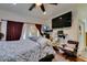 Spacious bedroom with French doors, wood floors, and a ceiling fan at 5515 N Campbell Rd, Las Vegas, NV 89149