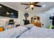 Bedroom with a large flat screen TV, wood floors, and access to outdoor space at 5515 N Campbell Rd, Las Vegas, NV 89149
