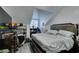 Bright bedroom featuring angled ceilings, wood floors, and space-saving shelves for optimal storage at 5515 N Campbell Rd, Las Vegas, NV 89149