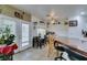 Inviting dining area features access to the outdoors, a tiled floor, and a convenient breakfast bar at 5515 N Campbell Rd, Las Vegas, NV 89149
