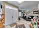 Welcoming foyer featuring tile flooring, an ornate horse statue, and a view of the living room at 5515 N Campbell Rd, Las Vegas, NV 89149