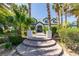 Charming two-story home with a lush, landscaped front yard and a welcoming stone walkway at 5515 N Campbell Rd, Las Vegas, NV 89149