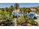 Home surrounded by palm trees and lush landscaping, enhancing its curb appeal and tropical feel at 5515 N Campbell Rd, Las Vegas, NV 89149