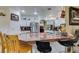 Spacious kitchen features stainless steel appliances and a long countertop bar with seating for the entire Gathering at 5515 N Campbell Rd, Las Vegas, NV 89149