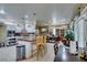 Bright open concept kitchen with a bar and adjoining dining area, great for entertaining guests at 5515 N Campbell Rd, Las Vegas, NV 89149