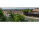 Neighborhood view of the landscape with native greenery and distant city buildings at 5515 N Campbell Rd, Las Vegas, NV 89149
