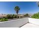 Scenic view of the neighborhood with a palm tree and mountains in the distance, seen from a balcony at 5515 N Campbell Rd, Las Vegas, NV 89149