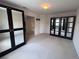 Bedroom featuring carpet floors and mirrored sliding closet doors at 577 Leap Frog Ave, Las Vegas, NV 89183