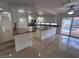 Modern kitchen with white cabinets, granite countertops, and stainless steel appliances at 577 Leap Frog Ave, Las Vegas, NV 89183