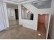 Bright living room boasts tile floors, fresh paint and staircase access to the second level at 577 Leap Frog Ave, Las Vegas, NV 89183