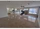 Bright living space showcasing a fireplace, open layout, and access to the kitchen at 577 Leap Frog Ave, Las Vegas, NV 89183