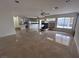 Bright living space showcasing a fireplace, open layout, and access to the kitchen at 577 Leap Frog Ave, Las Vegas, NV 89183
