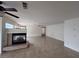 Large living space featuring a fireplace, tile floors, and modern ceiling fans at 577 Leap Frog Ave, Las Vegas, NV 89183