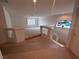 Bright carpeted loft area features a stained glass window and a railing at 577 Leap Frog Ave, Las Vegas, NV 89183