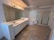 Main bathroom features double sinks, soaking tub, and a separate shower stall at 577 Leap Frog Ave, Las Vegas, NV 89183