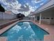 Backyard pool features a built-in gazebo and privacy walls at 577 Leap Frog Ave, Las Vegas, NV 89183
