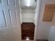 Walk-in closet with custom shelving and hardwood floors at 577 Leap Frog Ave, Las Vegas, NV 89183