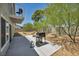 Cozy backyard with a concrete patio and a grill, perfect for outdoor entertaining at 6815 Garden Grove Ave, Las Vegas, NV 89103