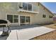 Backyard with a concrete patio and a grill, leading up to a second story balcony at 6815 Garden Grove Ave, Las Vegas, NV 89103
