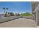A spacious balcony offers views of the neighborhood and palm trees under a clear blue sky at 6815 Garden Grove Ave, Las Vegas, NV 89103