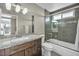 Bathroom featuring granite vanity top, updated fixtures, and a tub-shower combo at 6815 Garden Grove Ave, Las Vegas, NV 89103