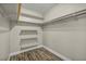 Walk-in closet with built-in shelving and rod, offering ample storage space at 6815 Garden Grove Ave, Las Vegas, NV 89103