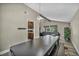 Bright dining area with a large table and stylish lighting at 6815 Garden Grove Ave, Las Vegas, NV 89103