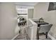 A stairway leads to the living room; a desk sits next to the stairs at 6815 Garden Grove Ave, Las Vegas, NV 89103