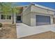Charming home with a modern garage door, fresh walkway, and a landscaped front yard at 6815 Garden Grove Ave, Las Vegas, NV 89103
