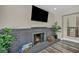 Living room fireplace with logs at 6815 Garden Grove Ave, Las Vegas, NV 89103