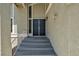 Elegant front entrance featuring a double door, modern lighting, and steps leading to the foyer at 6815 Garden Grove Ave, Las Vegas, NV 89103