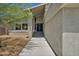Stylish home entrance with a walkway and attractive landscaping at 6815 Garden Grove Ave, Las Vegas, NV 89103
