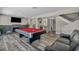 Spacious game room with a pool table and modern fireplace at 6815 Garden Grove Ave, Las Vegas, NV 89103