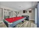 Well lit game room with a pool table, wet bar, and access to the upper floors at 6815 Garden Grove Ave, Las Vegas, NV 89103