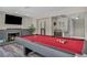 Bright game room featuring a pool table, fireplace, and built-in bar at 6815 Garden Grove Ave, Las Vegas, NV 89103