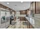 Modern kitchen with stainless steel appliances and dark wood cabinetry at 6815 Garden Grove Ave, Las Vegas, NV 89103
