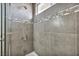 Stylish glass enclosed shower featuring modern fixtures and decorative tile accents at 6815 Garden Grove Ave, Las Vegas, NV 89103