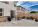 Backyard featuring an outdoor dining table with chairs and a barbecue grill at 688 Monument Point St, Henderson, NV 89002