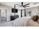 Stylish main bedroom featuring a modern ceiling fan and plenty of space at 688 Monument Point St, Henderson, NV 89002