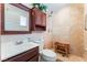 Tiled bathroom featuring a walk-in shower, vanity, and toilet offers a spa-like retreat within the home at 704 N Wallace Dr, Las Vegas, NV 89107